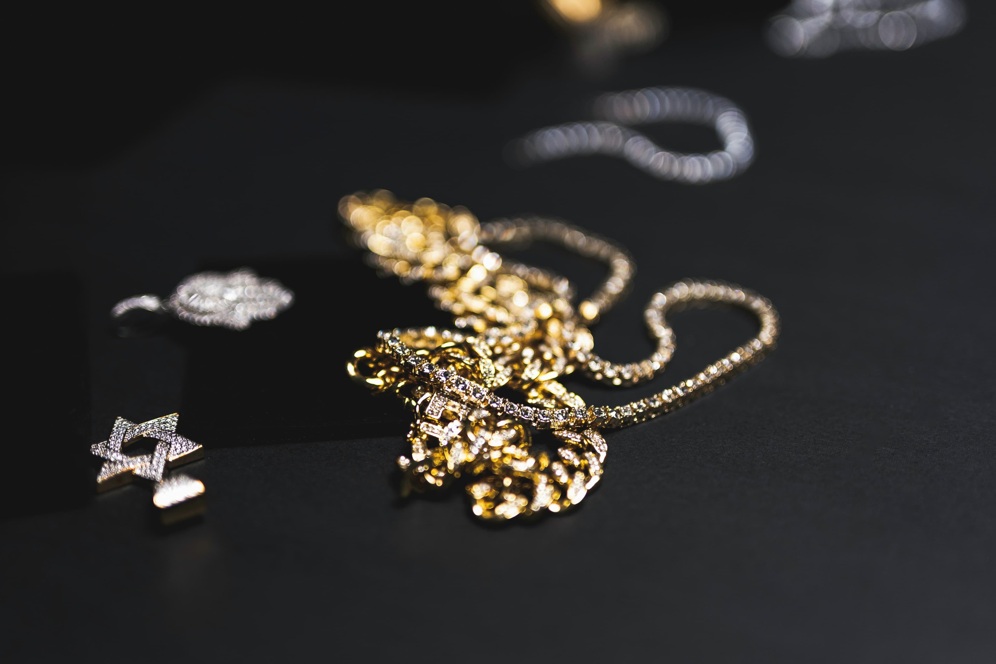 Close-up jewelry detail arranged in a premium editorial composition.